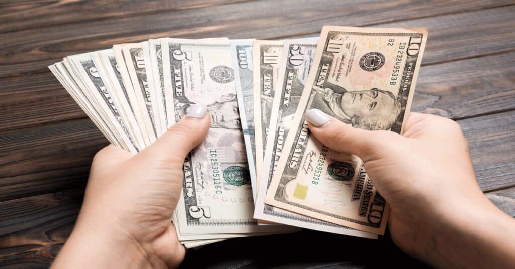 woman holding cash