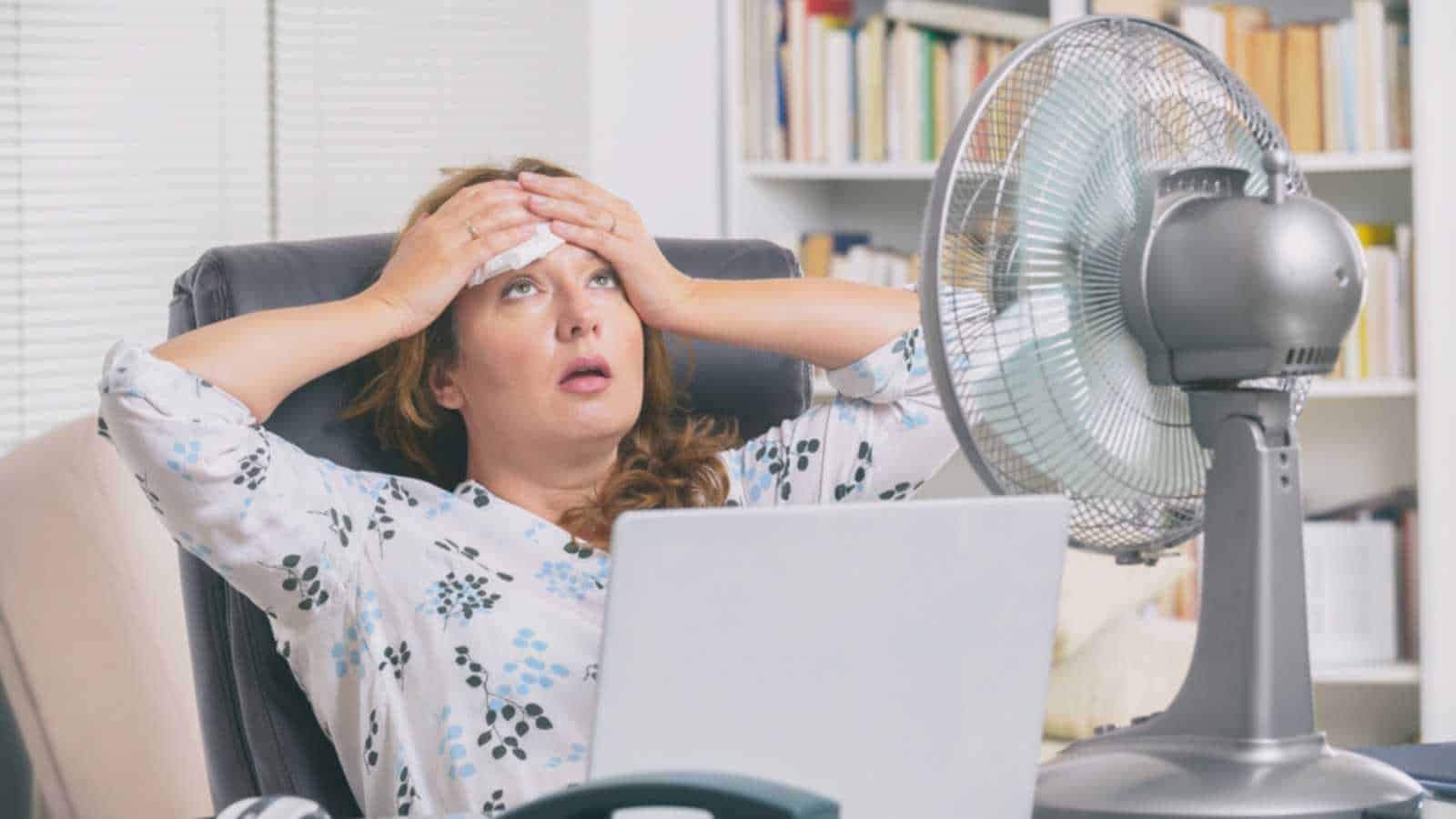 Woman stressed with hands on head