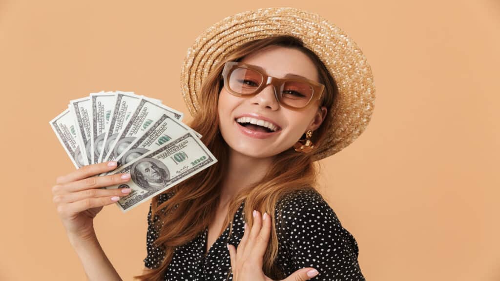 young woman holding money