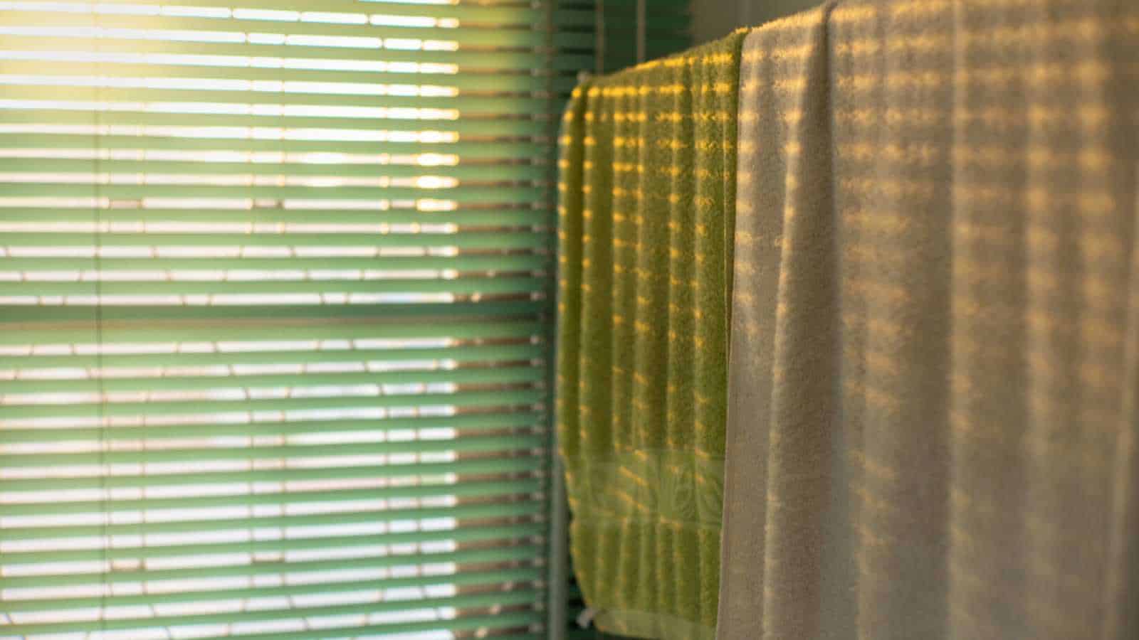 Hanging wet towels on window