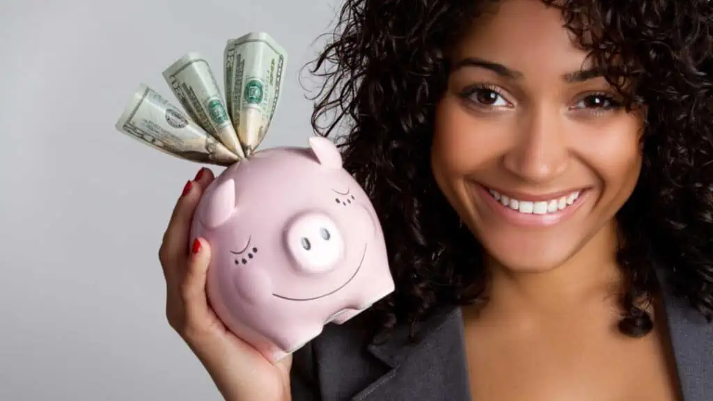 Happy woman saving money
