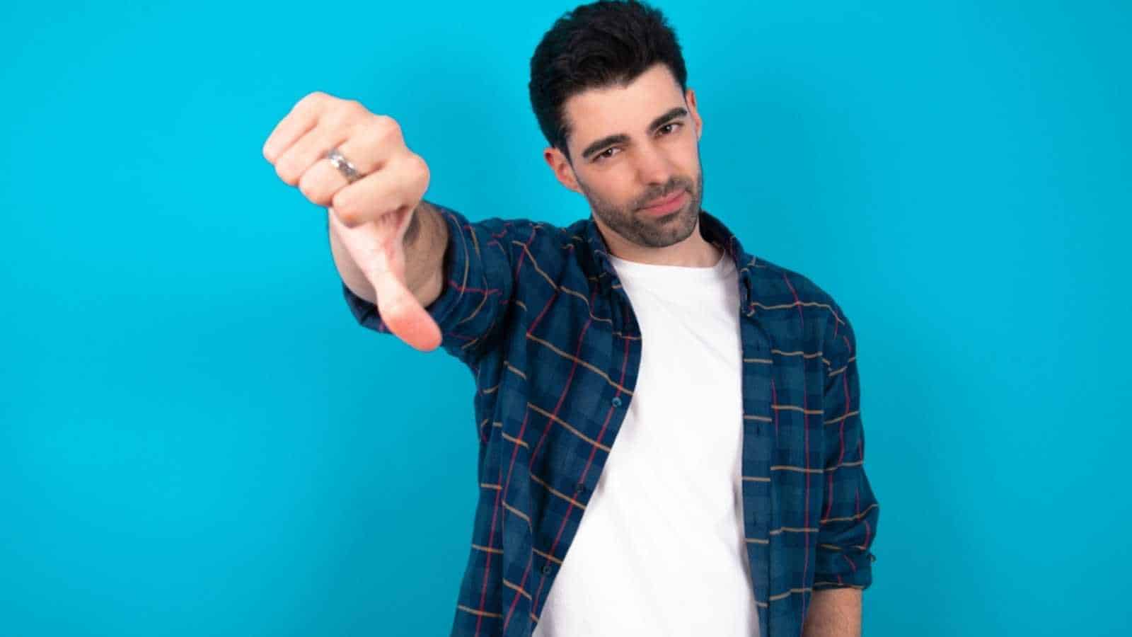 Man showing thumbs down