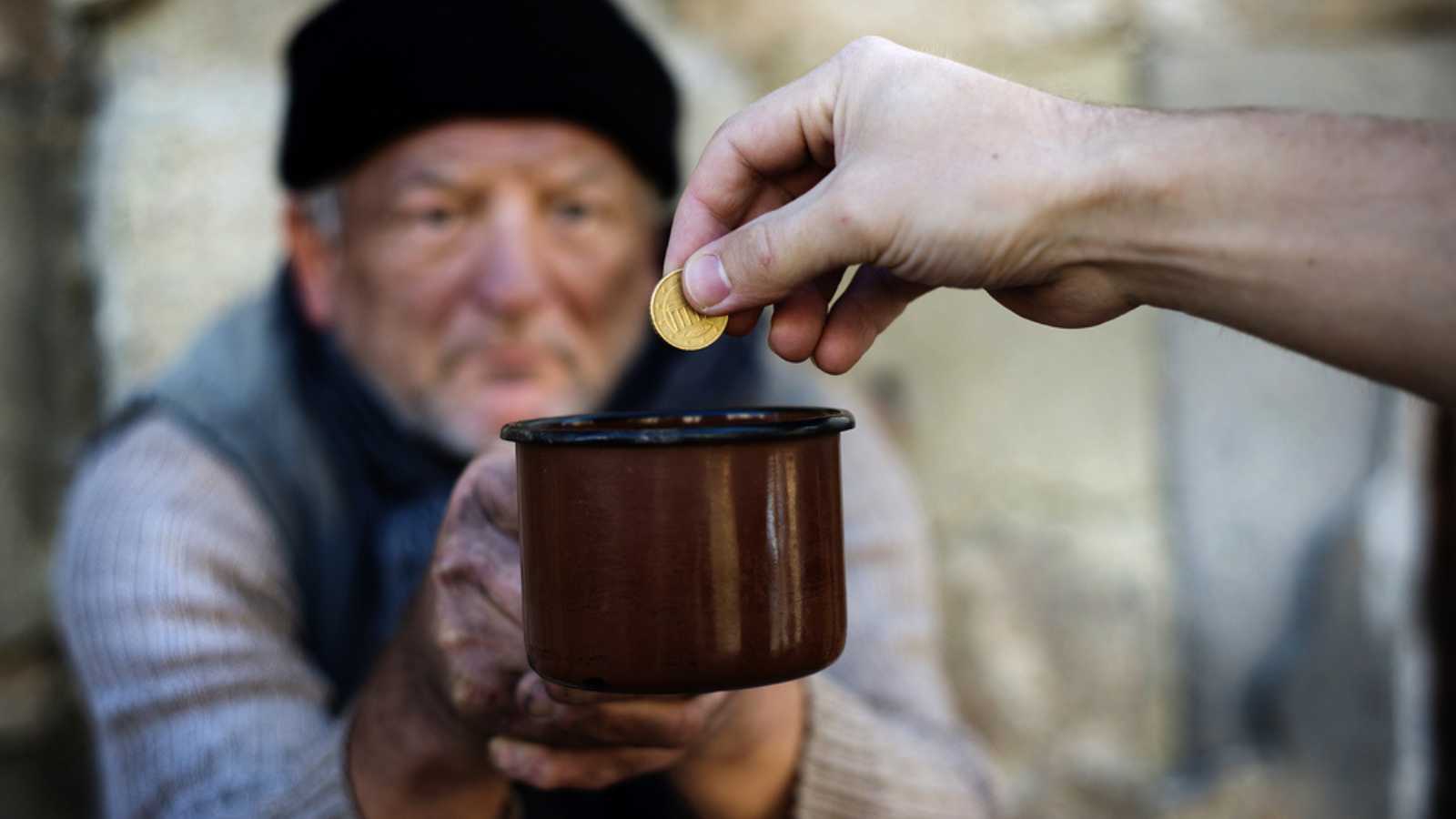 Giving change to homeless people