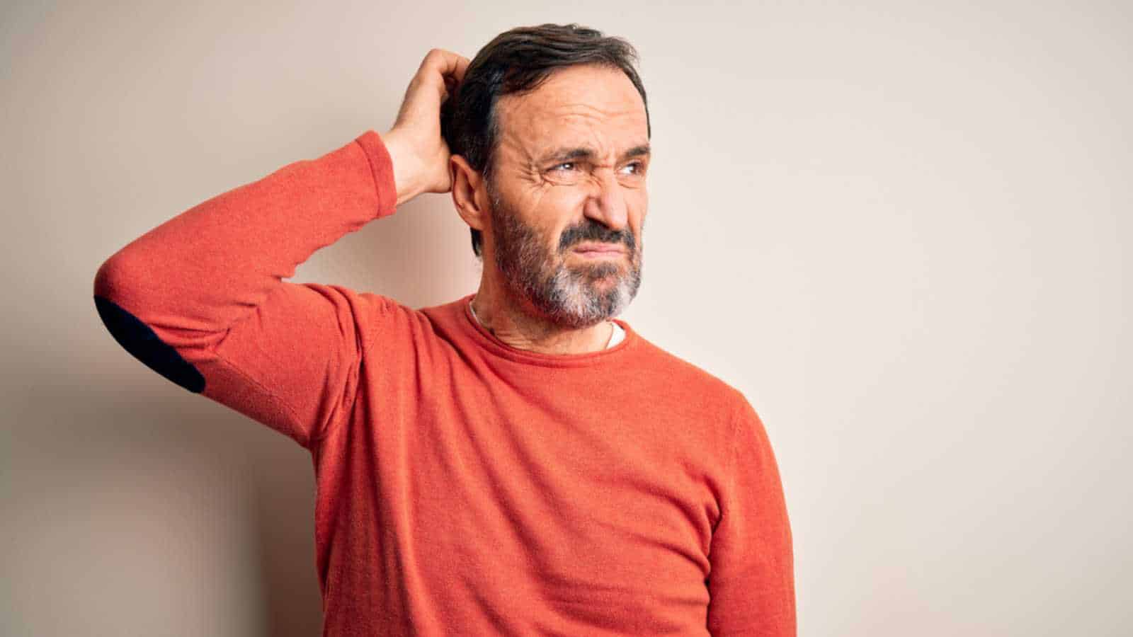 Man thinking and scratching head