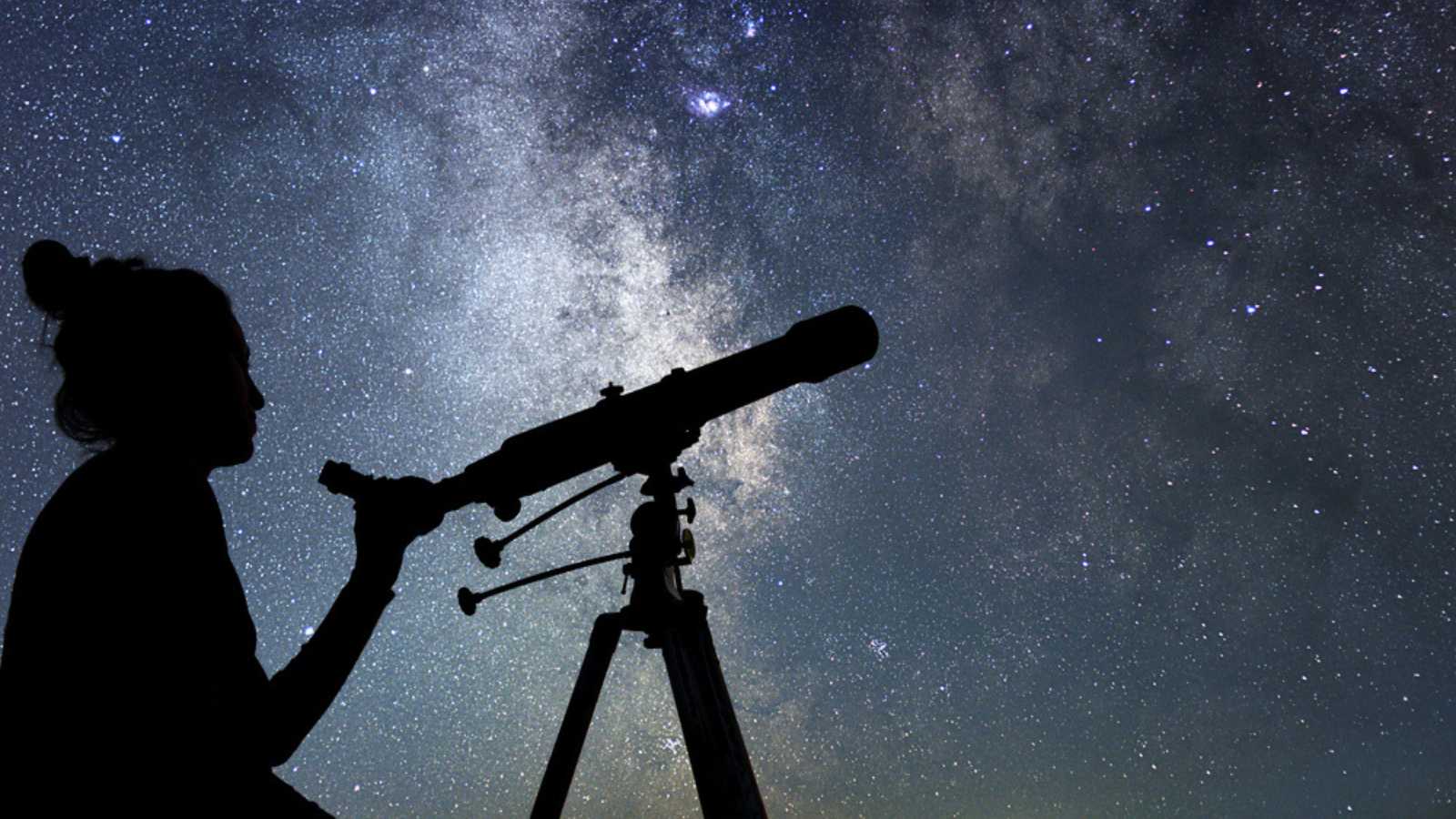 Woman using Telescope