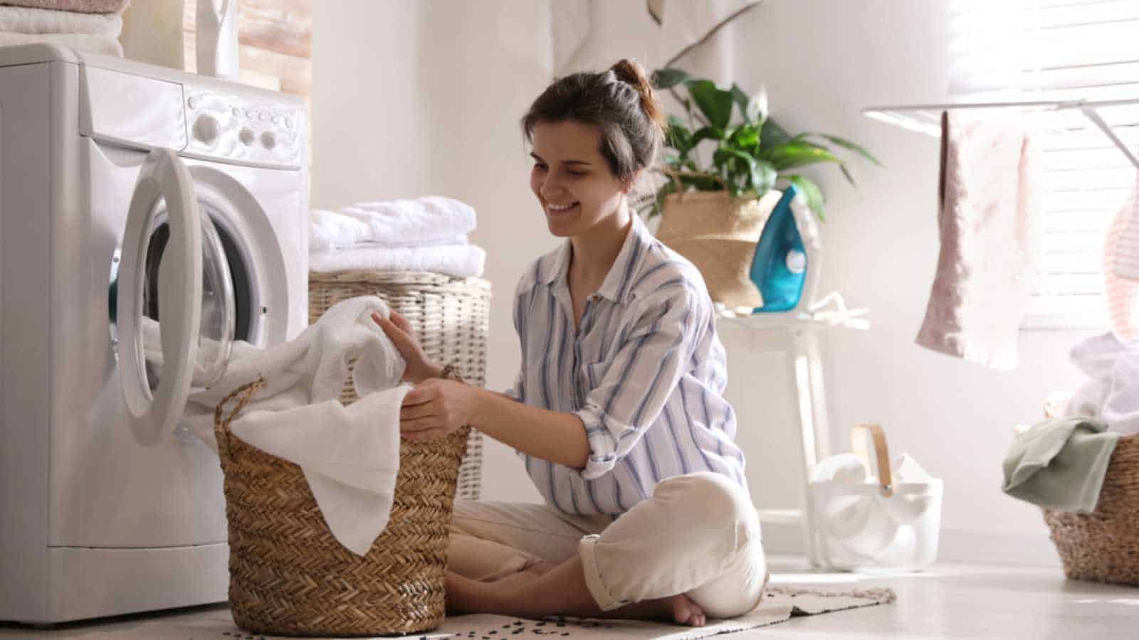 Woman using washing machine