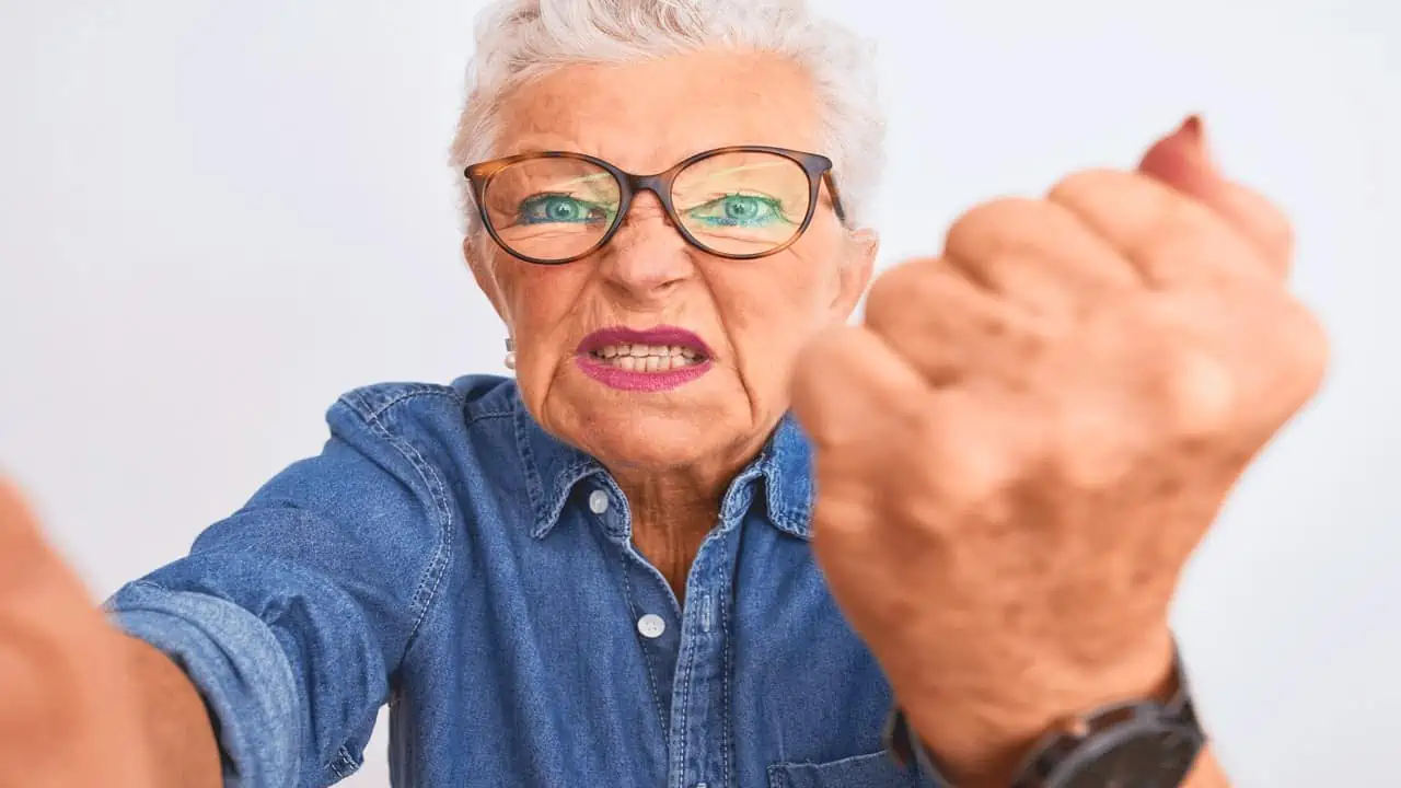 angry old lady making fist