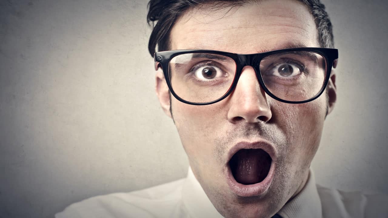 surprised man wearing glasses
