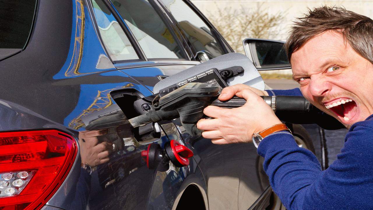 angry man pumping gas