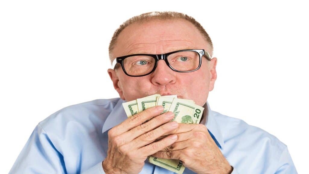 old man kissing money