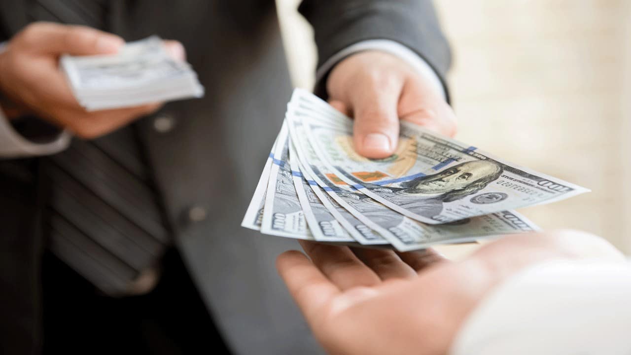 businessman paying cash