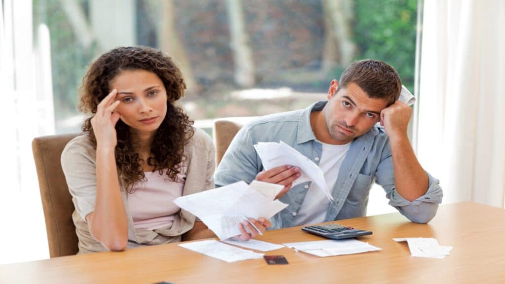 couple struggling financially, following the steps to get back on your feet financially.