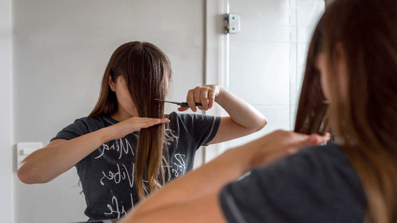 woman-cutting-own-hair