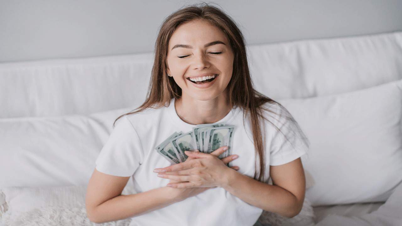 happy-woman-with-money