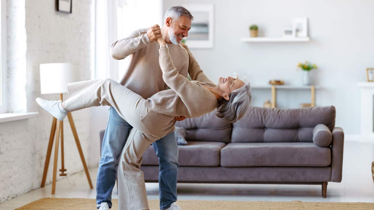 couple dancing in their home