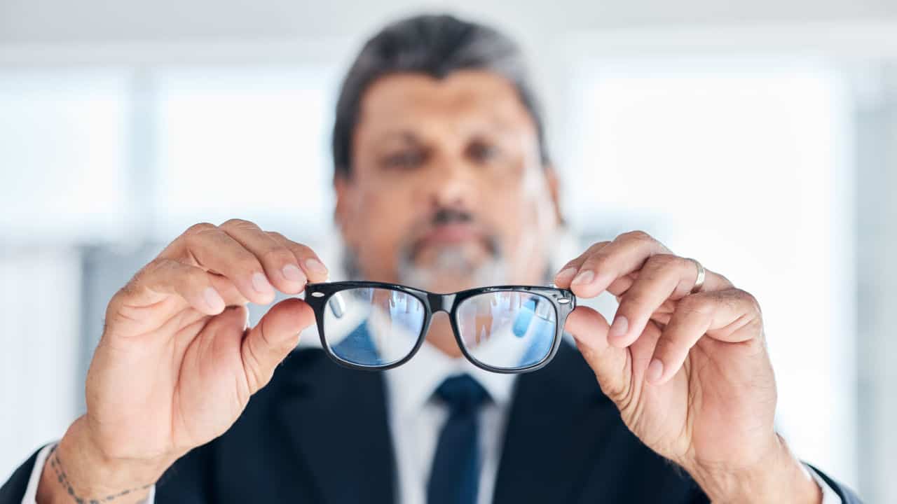Man holding glasses