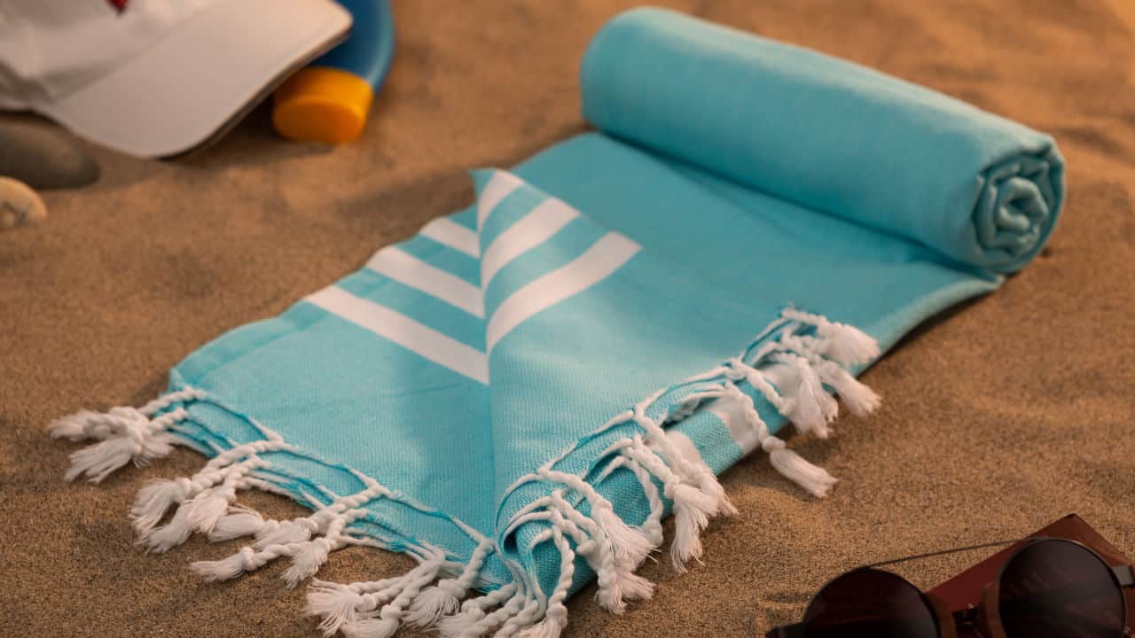 Sand Cloud, Handwoven hammam Turkish cotton towel on beach