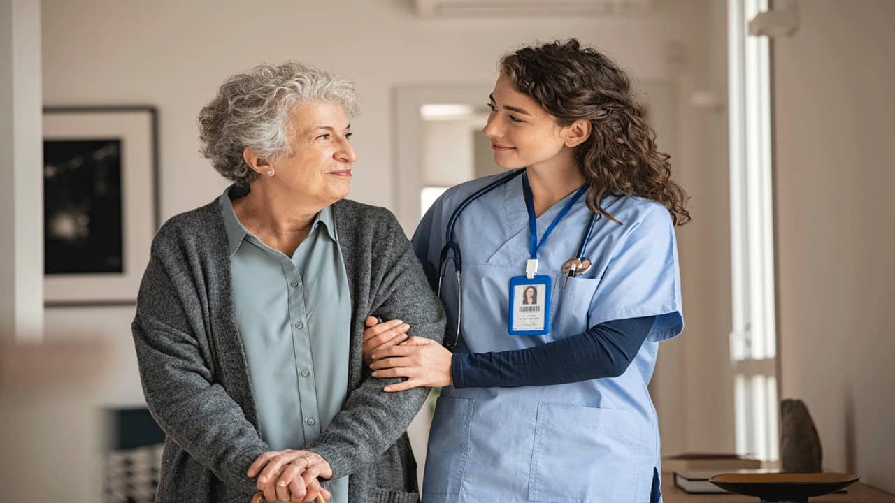 nurse-helping-elderly-woman