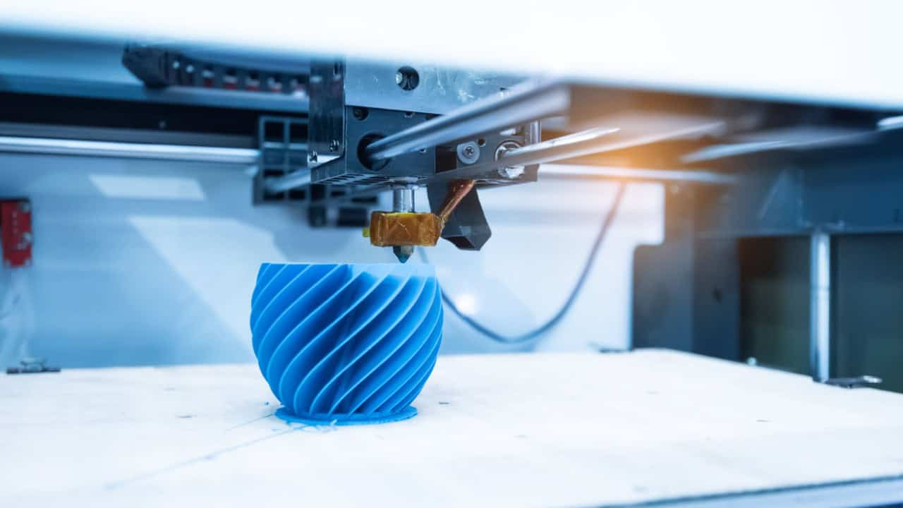 Modern 3D printer printing figure