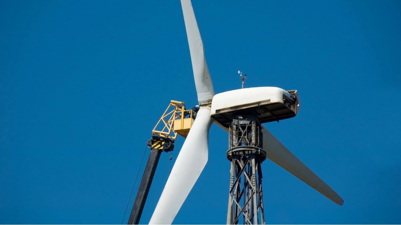 Man repairs windmill