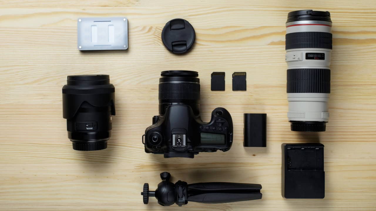 Flat lay composition with camera equipment for professional photographer
