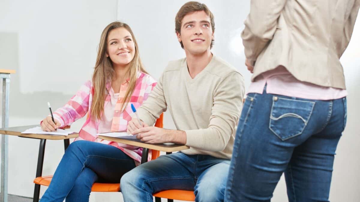 Students take notes in class at school